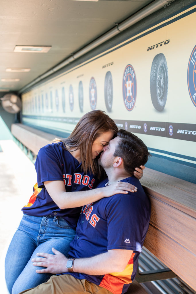 Intimate Photo of Engaged Couple Sitting in Astros Dugout